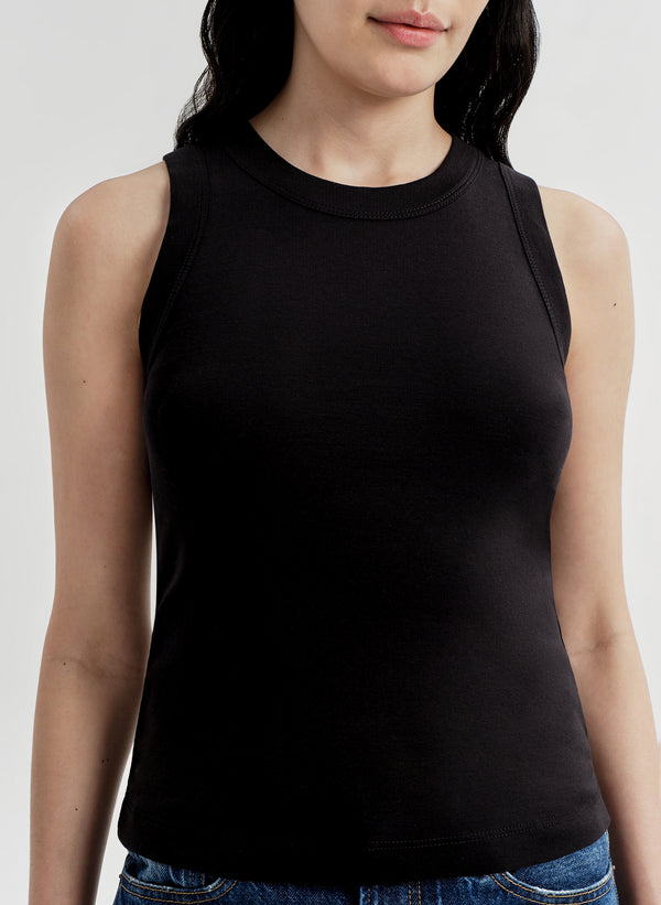Person wearing a black sleeveless top on a white background