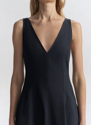 woman wearing navy blue midi dress