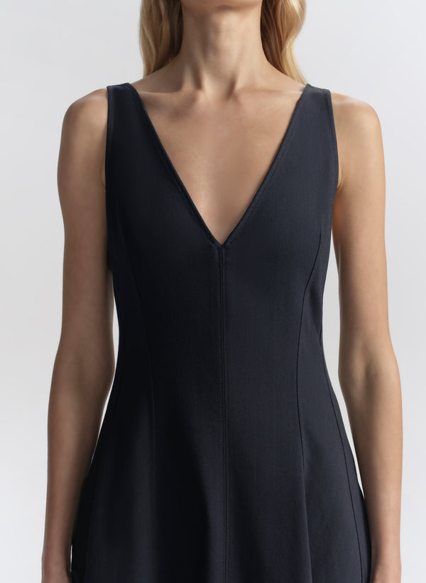 woman wearing navy blue midi dress