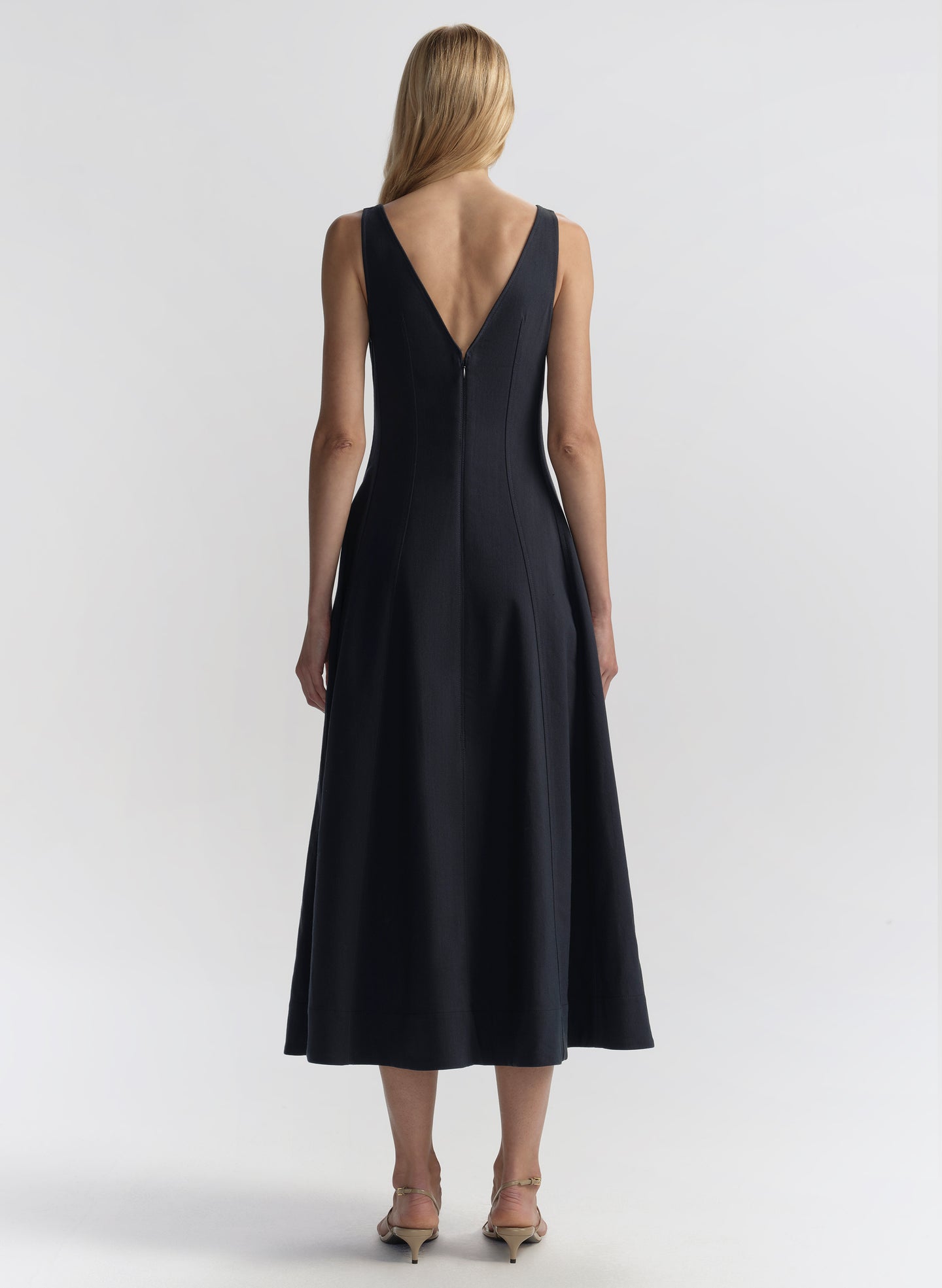 woman wearing navy blue midi dress