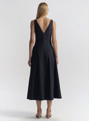 woman wearing navy blue midi dress