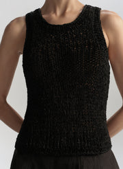 Black knitted sleeveless top on a mannequin against a neutral background