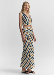 Woman wearing a striped top and skirt on a white background