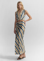 Woman wearing a striped outfit with a white background