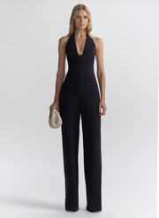 woman wearing navy blue halter jumpsuit