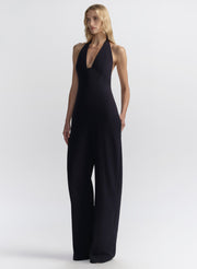 woman wearing navy blue halter jumpsuit