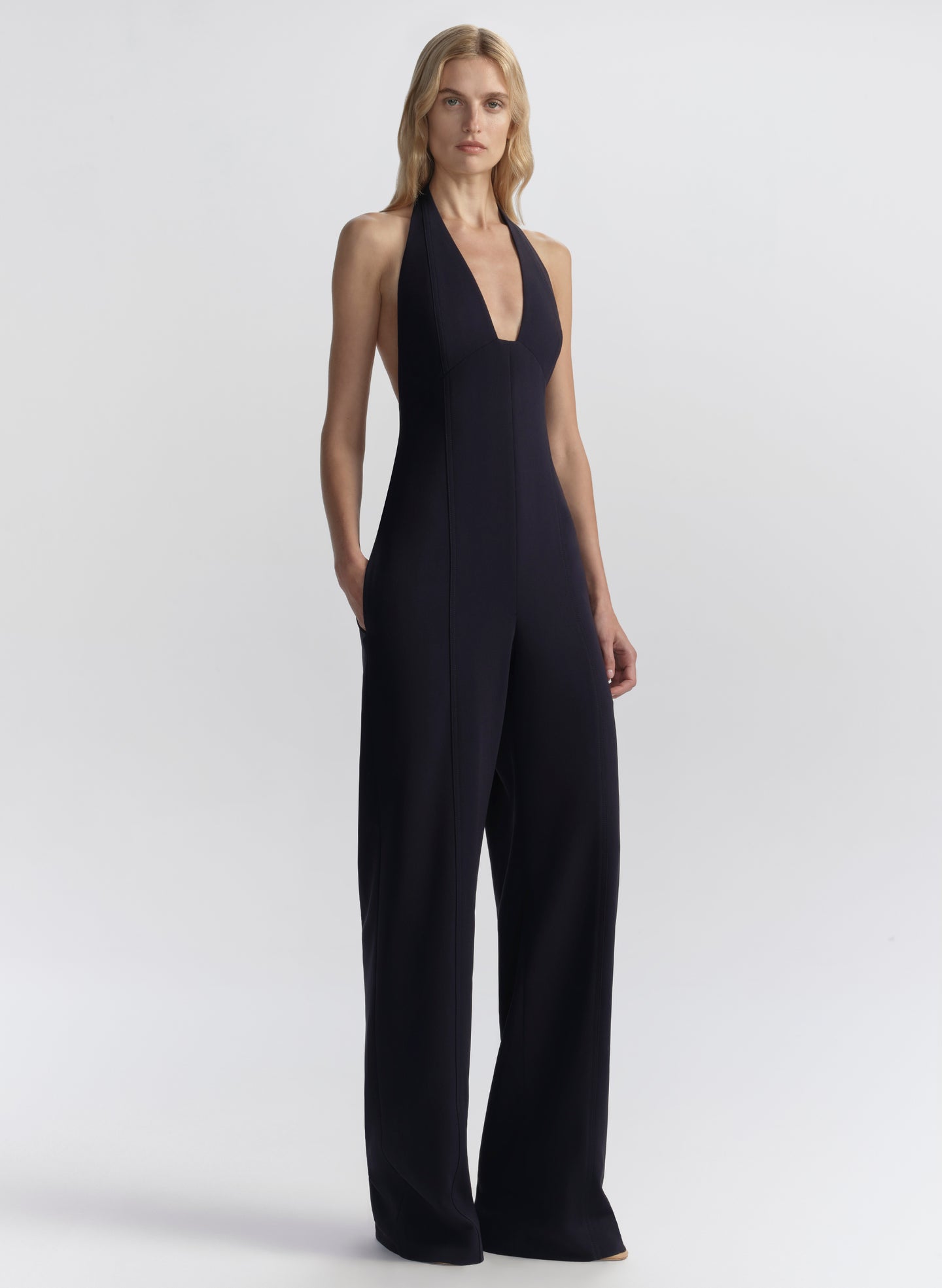 woman wearing navy blue halter jumpsuit