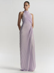 Woman wearing a lavender evening gown on a white background