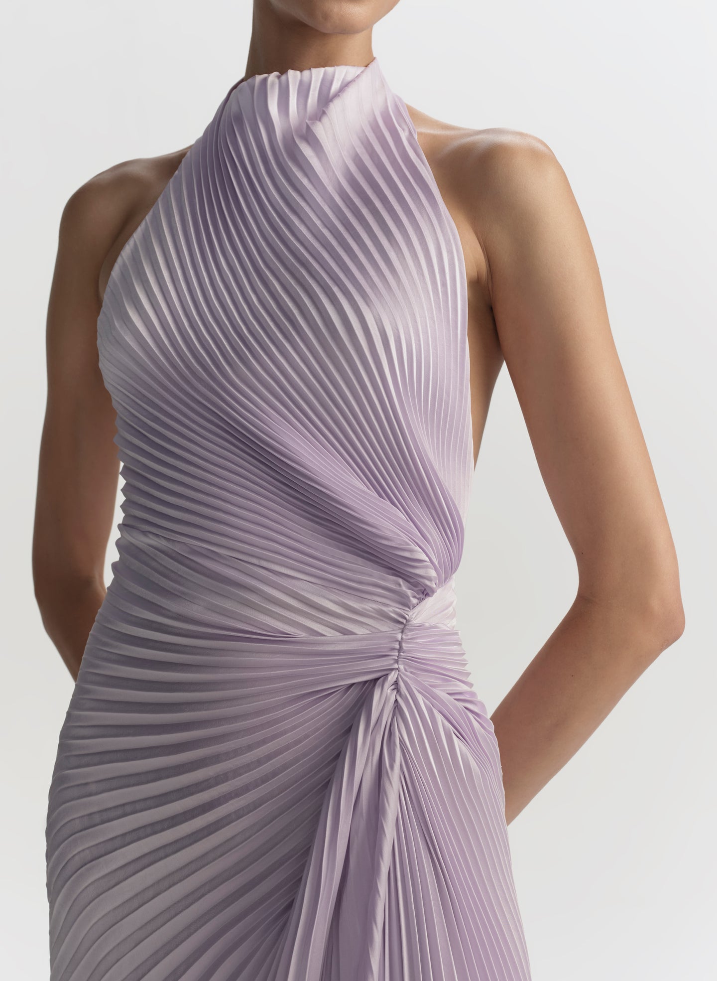 Lavender pleated dress on a plain background