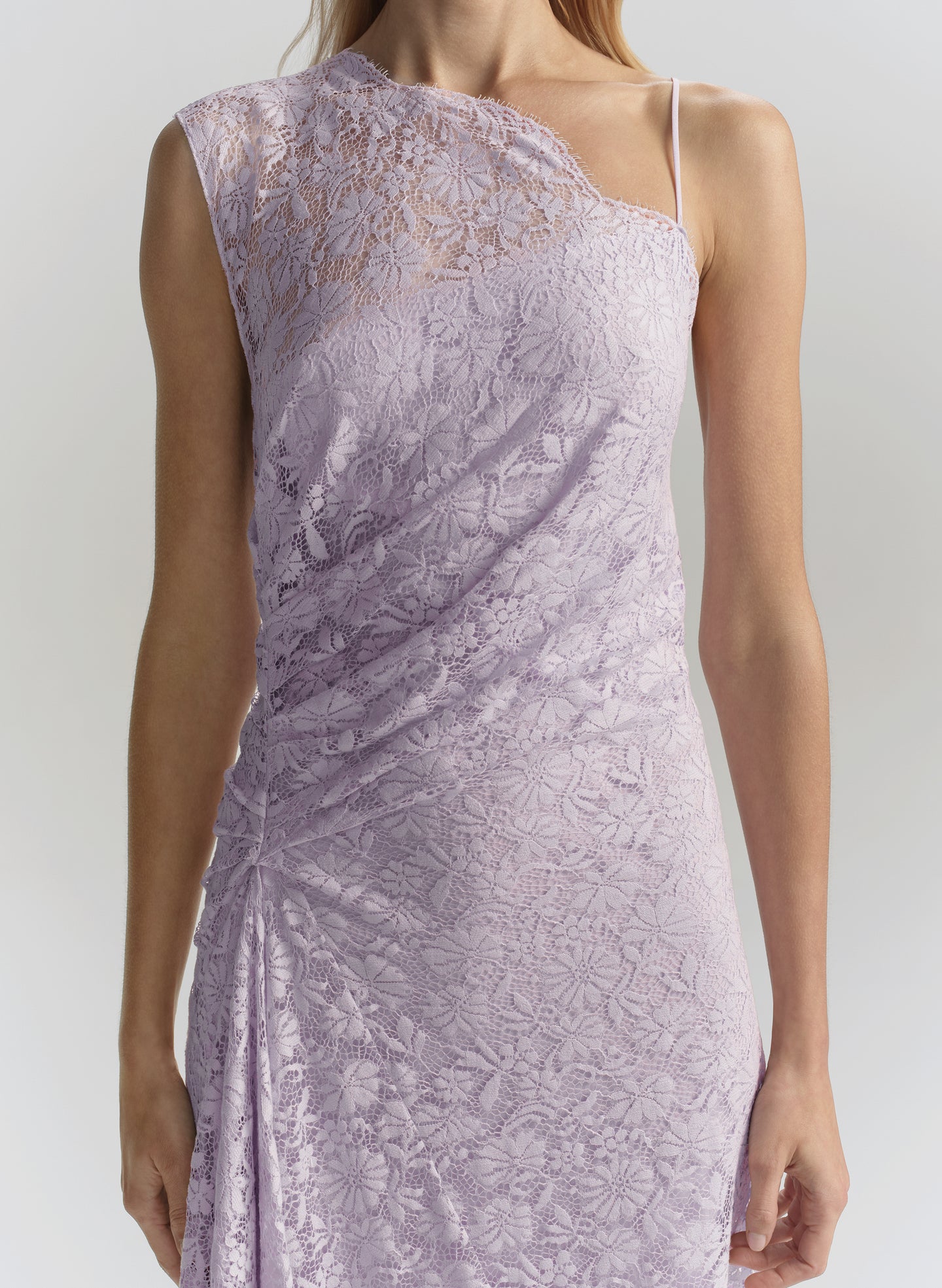 Lavender lace dress on a plain background