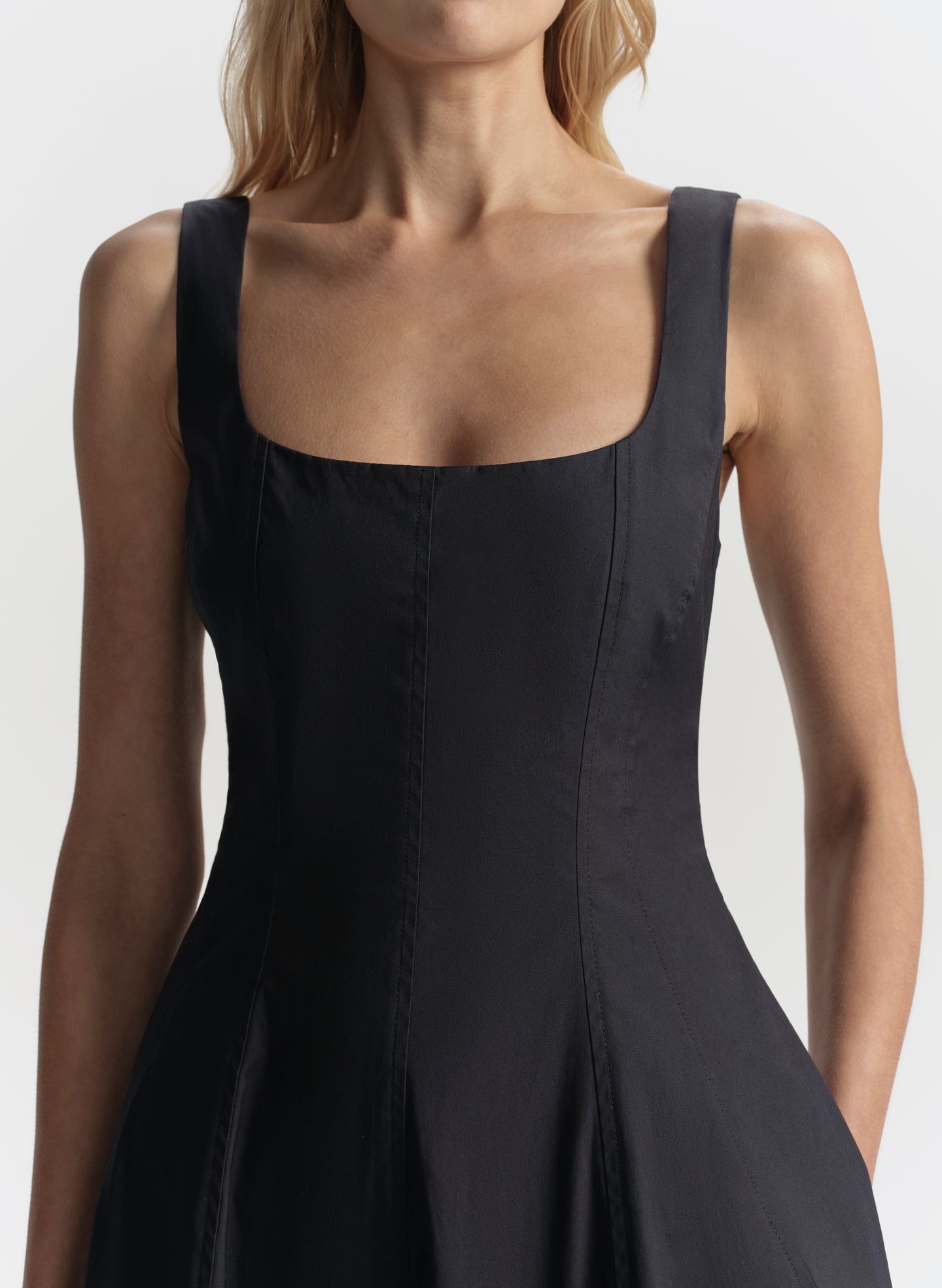 Blue dress worn by a model on a plain background