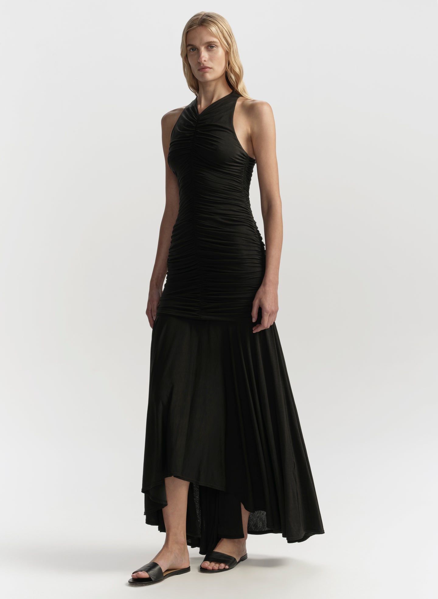 Woman wearing a black dress on a white background