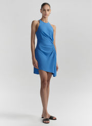 Woman wearing a blue dress on a white background