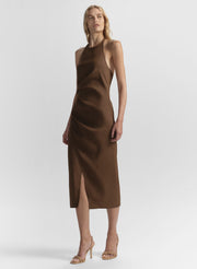 Woman wearing a brown dress on a white background