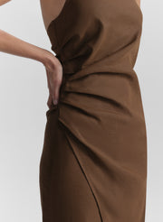 Brown dress with a ruching detail on a white background