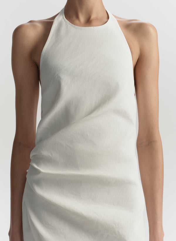 White sleeveless dress against a white background