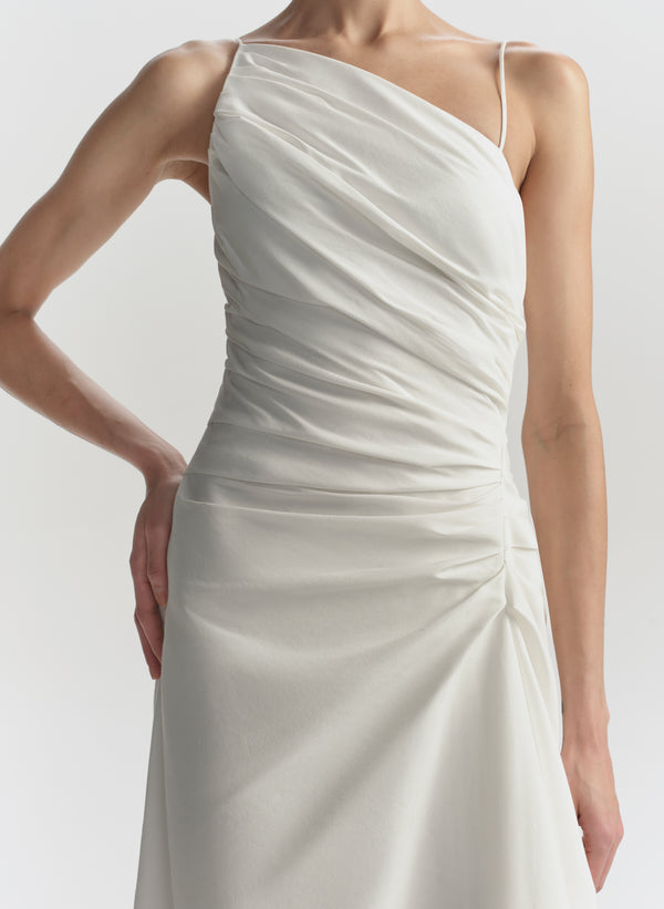 White one-shoulder dress on a plain background