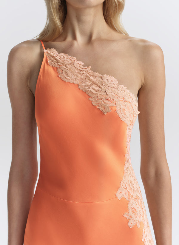 woman wearing orange midi dress