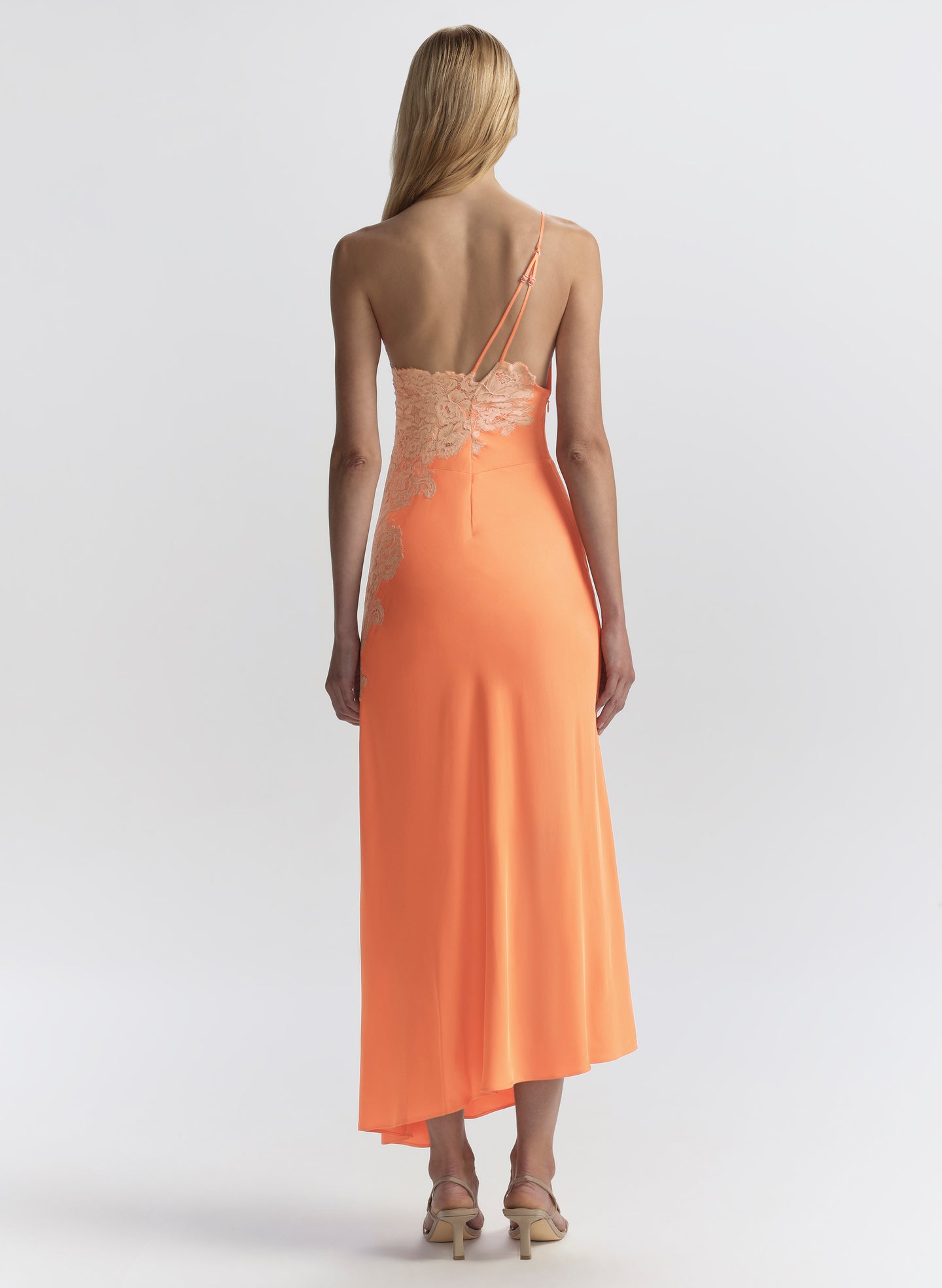 woman wearing orange midi dress