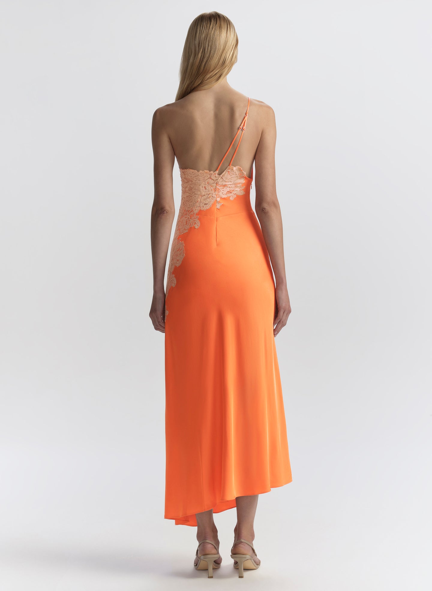 woman in orange midi dress with lace detail