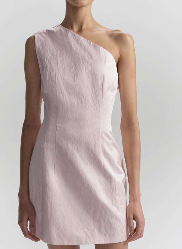 Pink one-shoulder dress worn by a model on a plain background