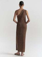 Woman wearing a brown one-shoulder dress on a white background