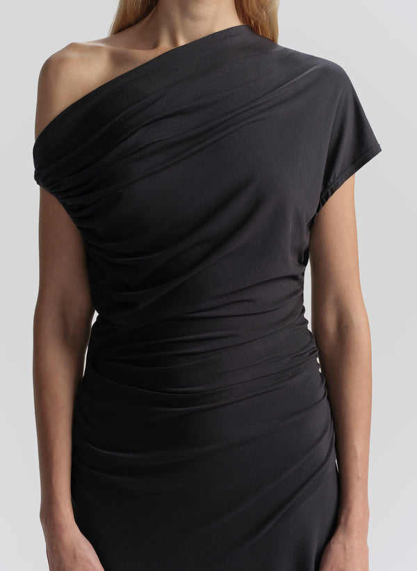 Blue one-shoulder dress on a plain background