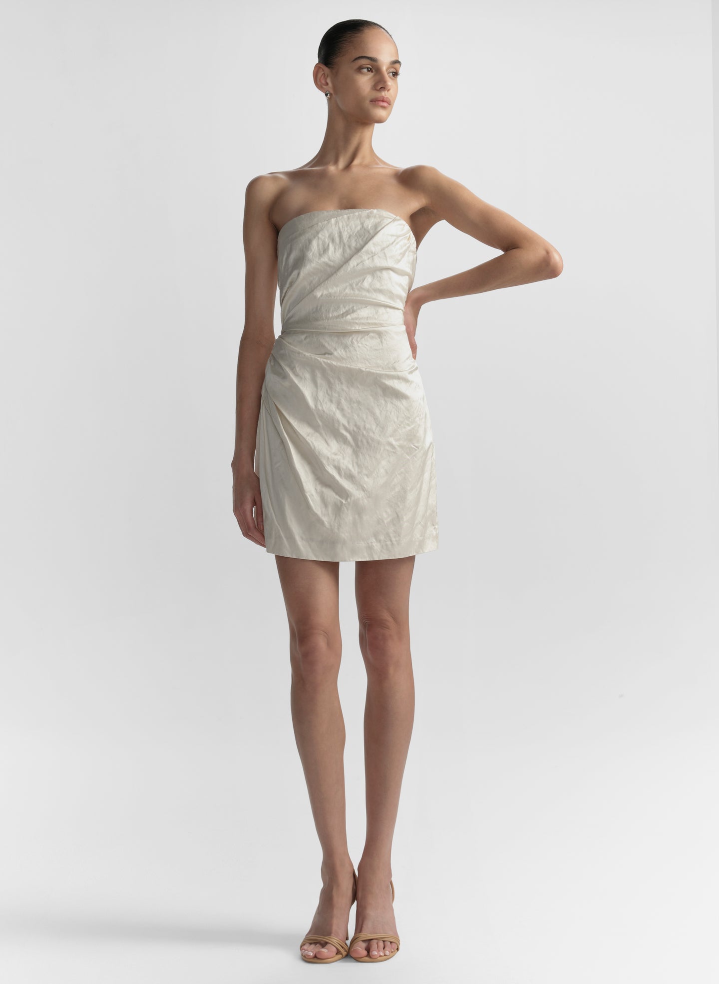 woman wearing white strapless mini dress