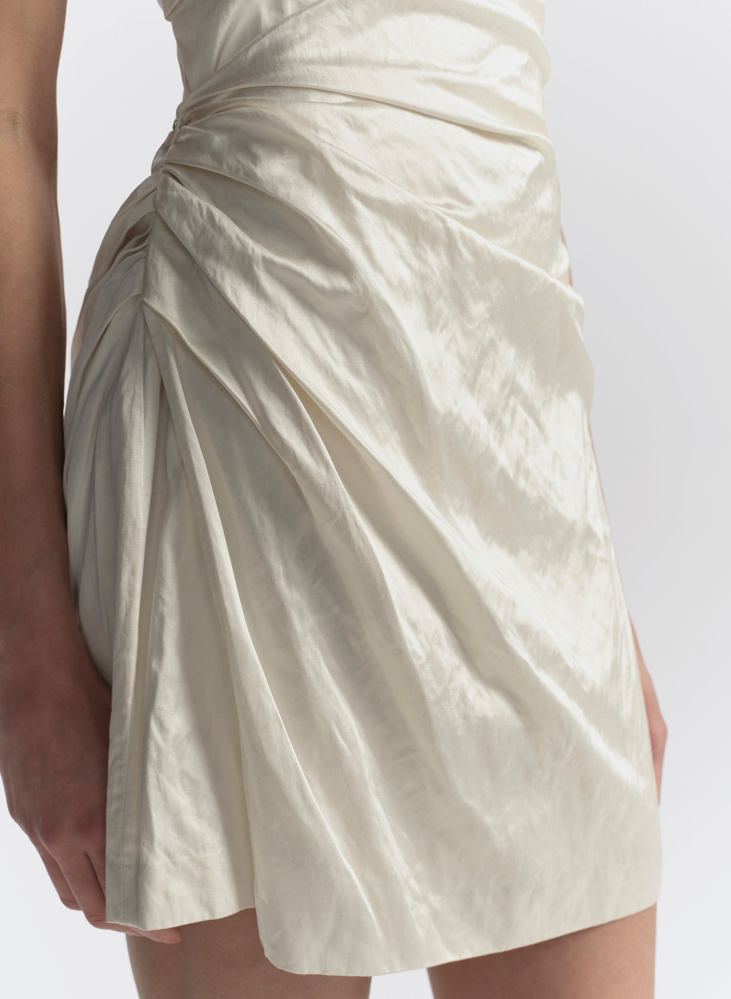 woman wearing white strapless mini dress