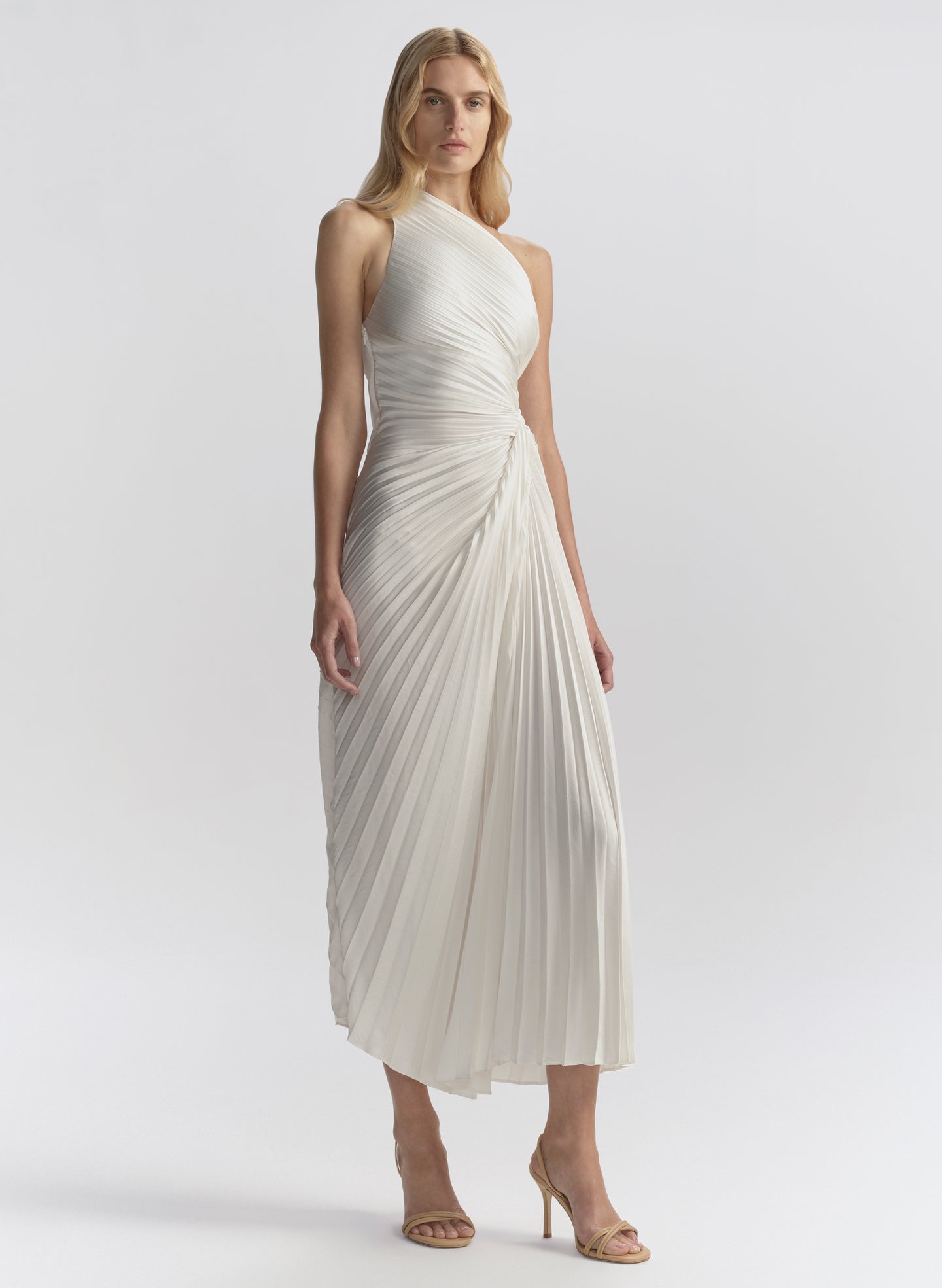 woman wearing white pleated midi dress