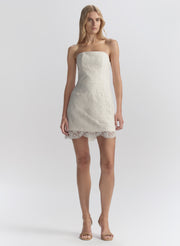 woman wearing white lace mini dress