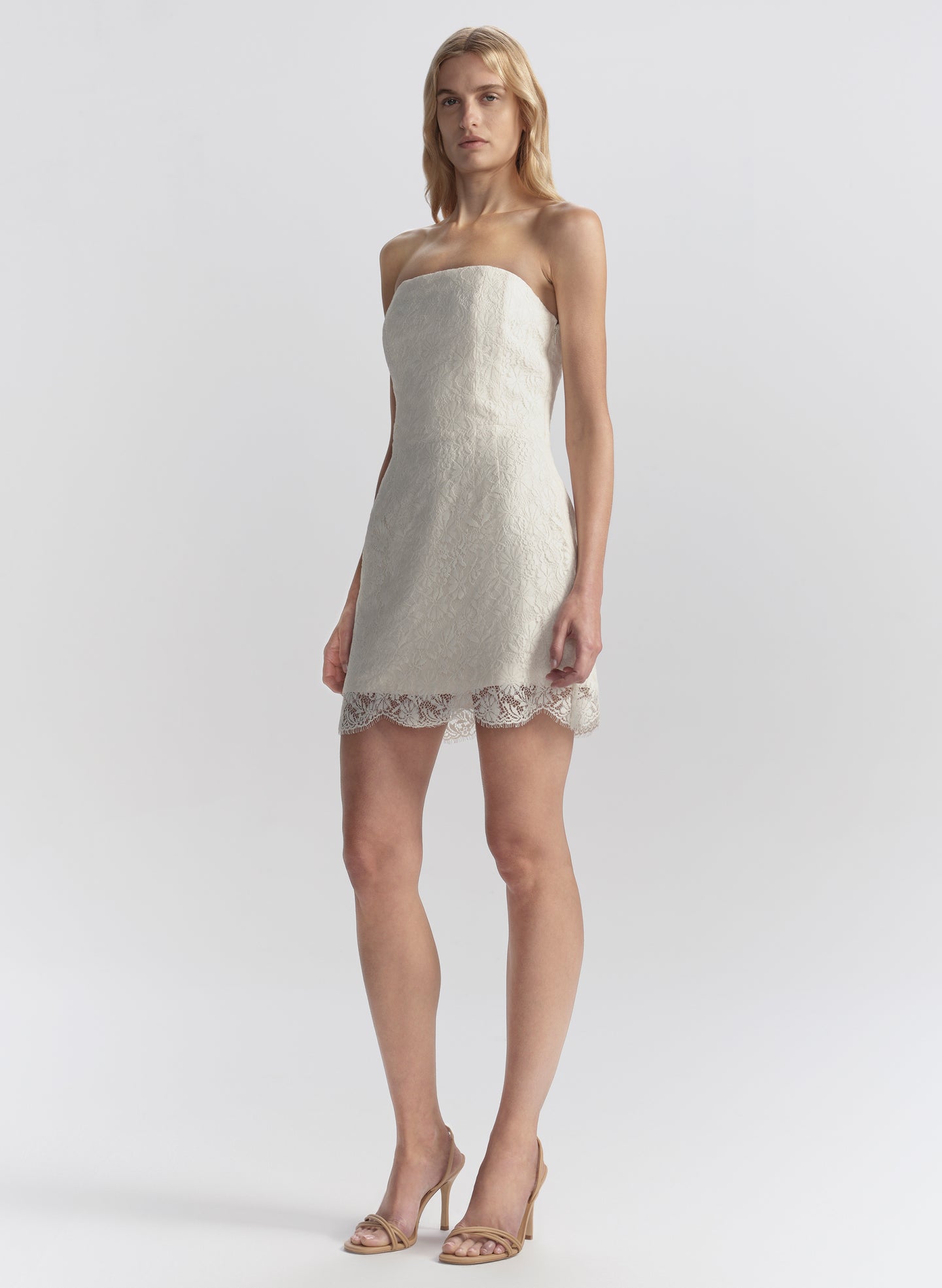 woman wearing white lace mini dress