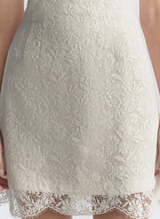 woman wearing white lace mini dress