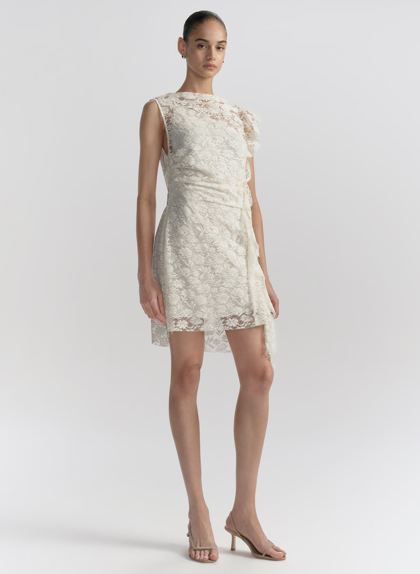 woman wearing white lace mini dress