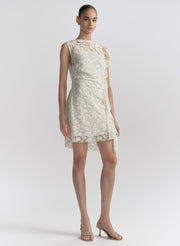 woman wearing white lace mini dress