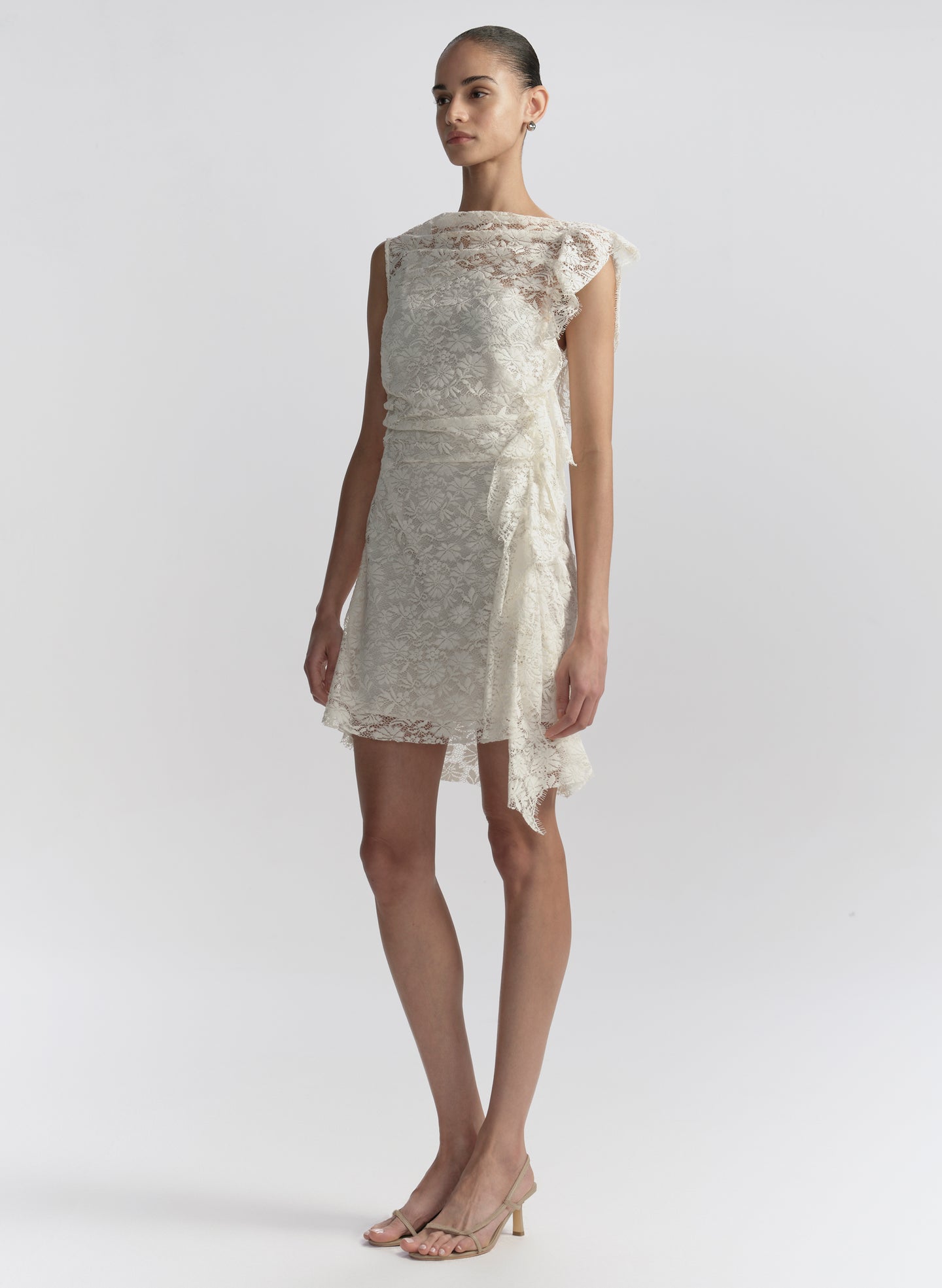 woman wearing white lace mini dress