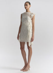 woman wearing white lace mini dress