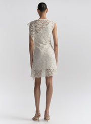 woman wearing white lace mini dress