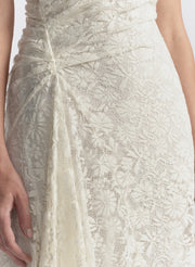 woman wearing white lace maxi dress