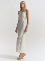 woman wearing white one shoulder lace trim midi dress