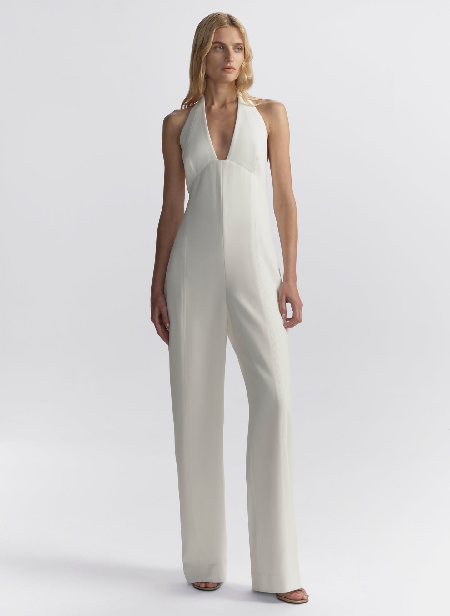woman wearing white halter jumpsuit