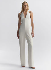 woman wearing white halter jumpsuit