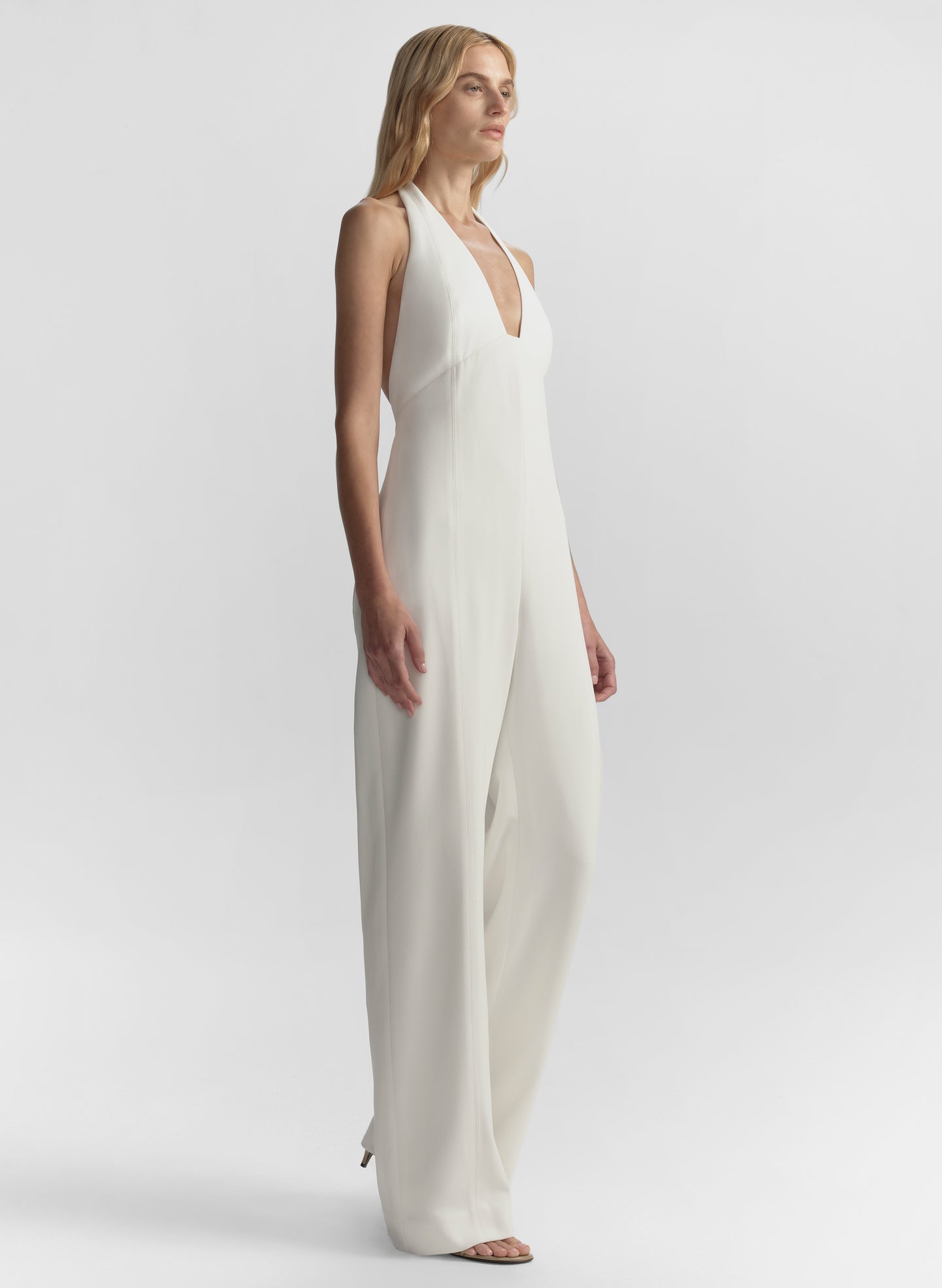 woman wearing white halter jumpsuit