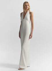 woman wearing white halter jumpsuit