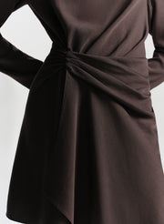 Brown dress with a knot detail on a white background
