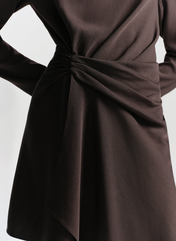 Brown dress with a knot detail on a white background
