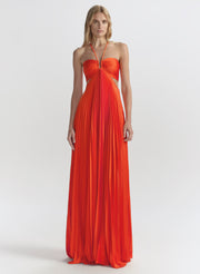 Woman wearing a poppy evening gown on a white background
