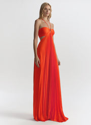 Woman wearing an orange evening gown on a white background