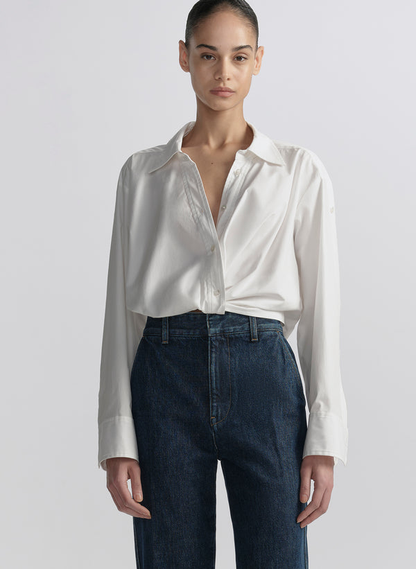 woman wearing white shirt and blue jeans