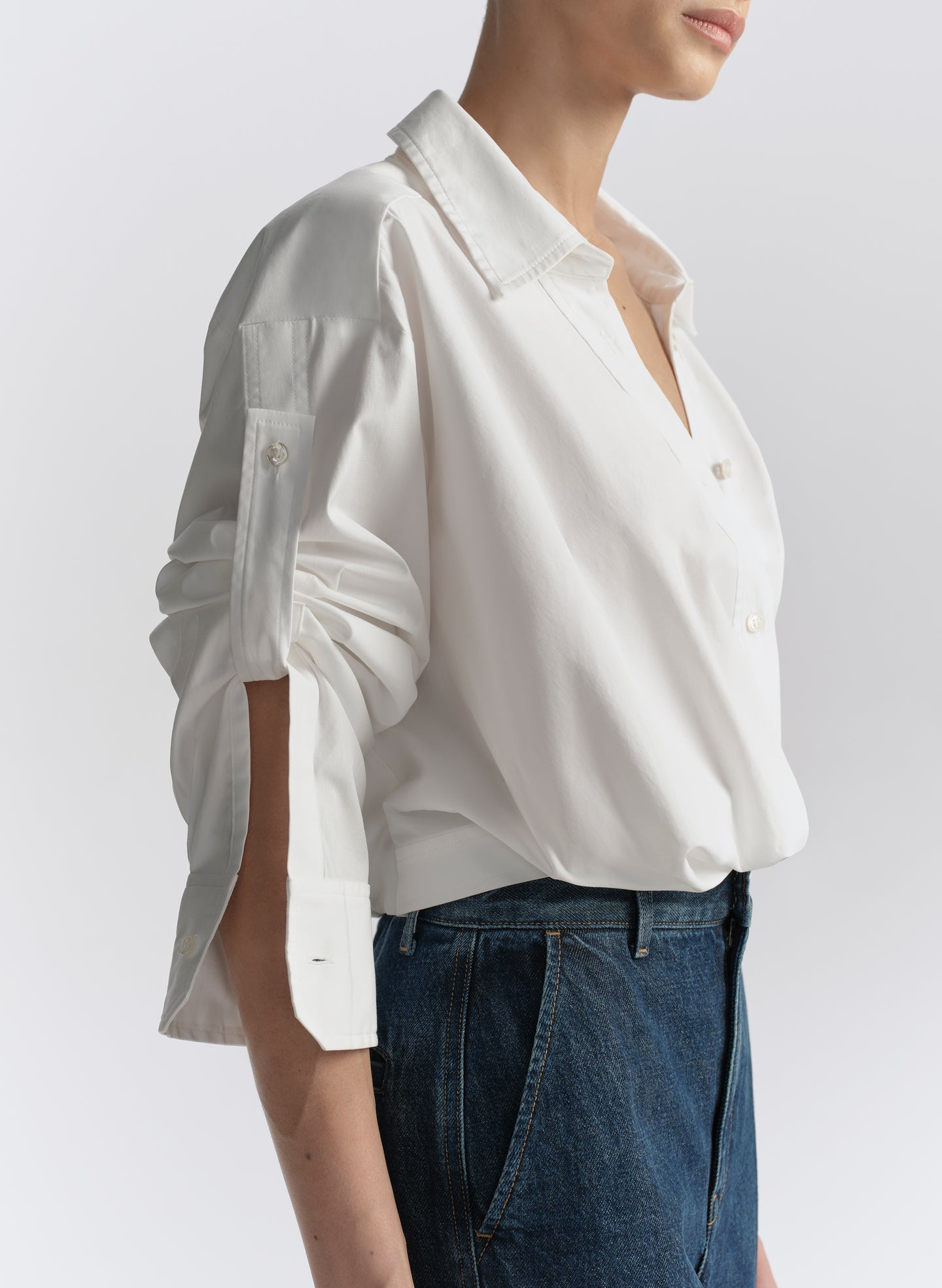 woman wearing white shirt and blue jeans